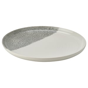 KRUSTISTEL plate, half white, half grey speckled, round, stoneware with textured design.