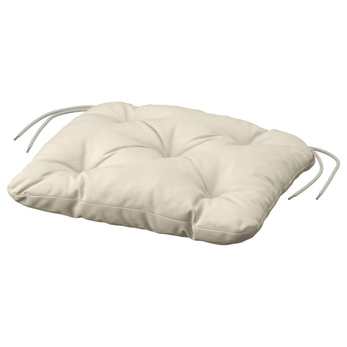 The KUDDARNA cushion is beige, rectangular with ties, designed for outdoor use with sustainable fabric.