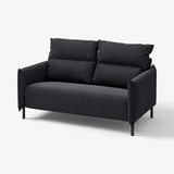 Black MANNARP loveseat. Modern design, dark grey upholstery, with cushioned seats and backrest, metal legs.