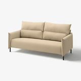 A beige MANNARP sofa with a modern design, made from cotton and polyester blend. It has a soft, inviting shape and minimalist style.