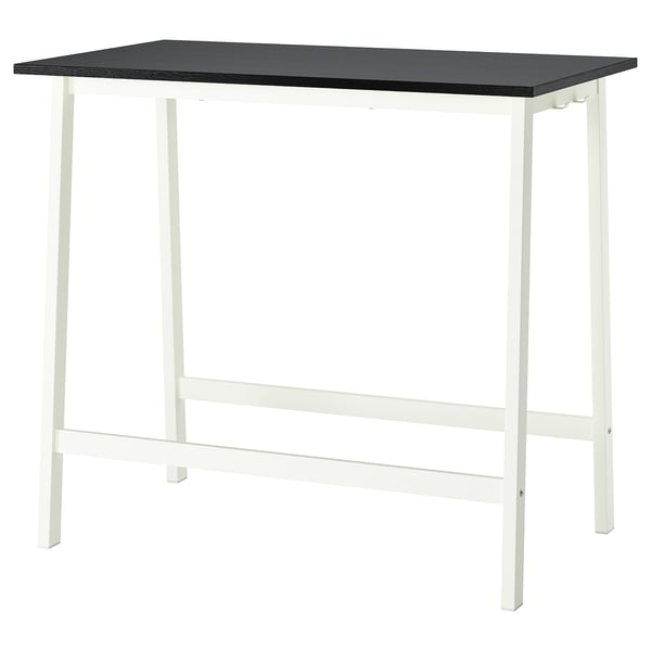 A MITTZON table. It is rectangular, white with a black top. Made of wood and metal, it has a simple, modern design.
