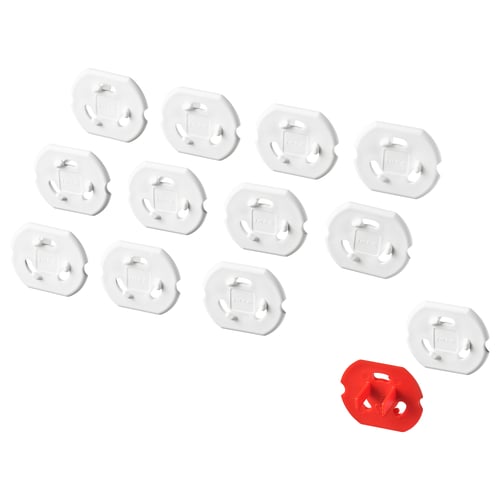 PATRULL safety plugs for electrical sockets. There are 11 white and 1 red plastic plug, designed for child safety.