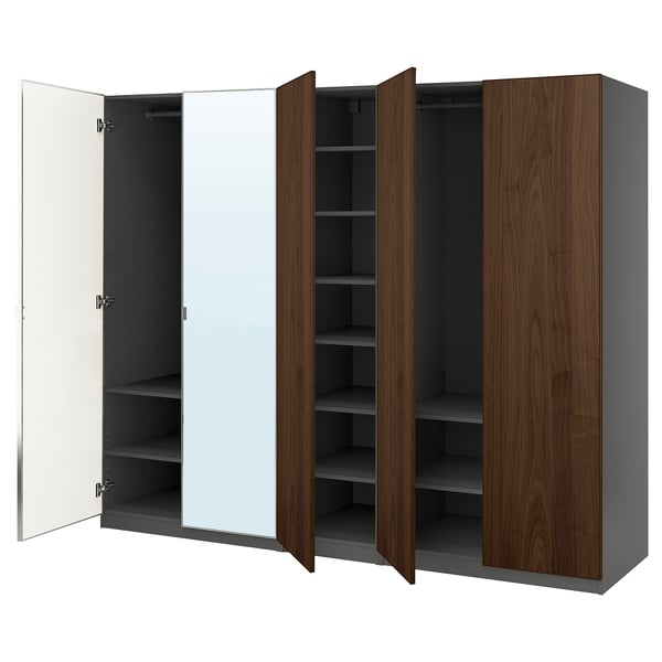 An open PAX wardrobe in dark wood and white, featuring shelves and a mirror.
