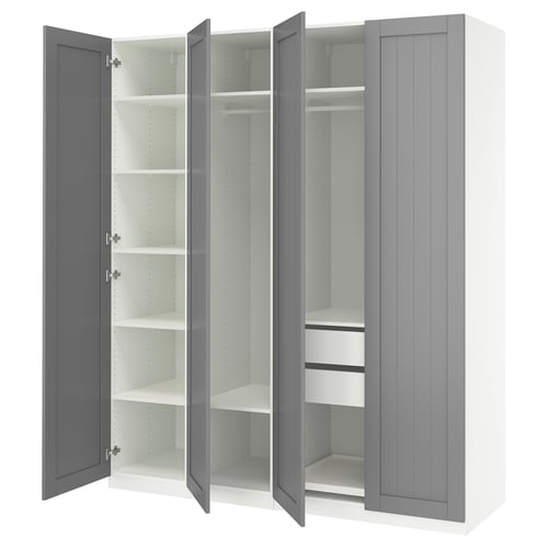 Grey PAX wardrobe open, empty shelves and drawers.