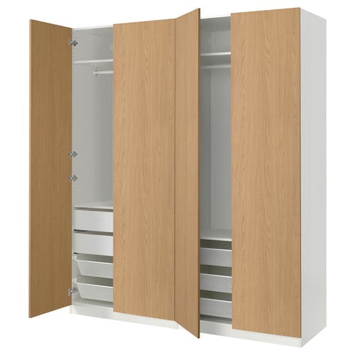 A white and light wood PAX wardrobe. It has four open sections revealing shelves and drawers.