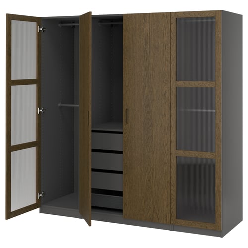 A modern wooden wardrobe, PAX in grey-brown with glass panels. It offers ample storage with shelves and drawers.