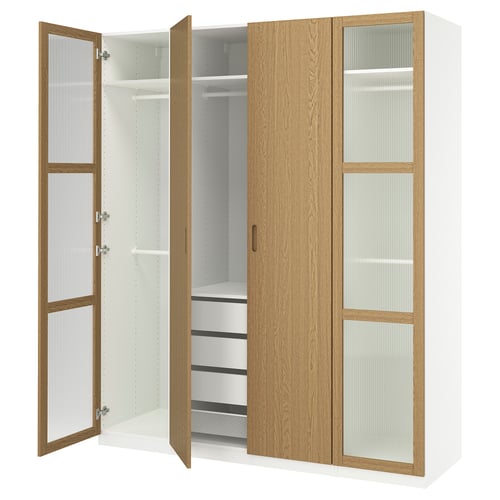 An open ikea PAX wardrobe in white and oak. It both solid and glass doors, displaying organized compartments with hanging rails and shelves.