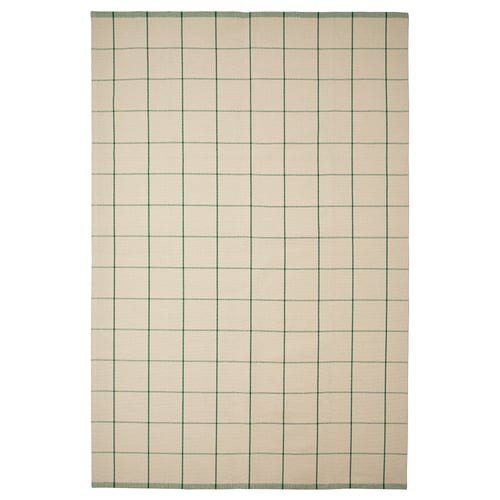 A rectangular RIDSTIG rug with a light beige background featuring green vertical stripes. It’s made of cotton and suitable for dining areas.