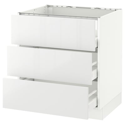 White SEKTION kitchen unit with glossy drawers, modern design.
