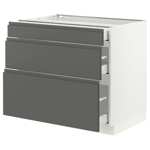 A modern, white kitchen cabinet with grey drawers. It has a sleek, rectangular design with integrated handles.