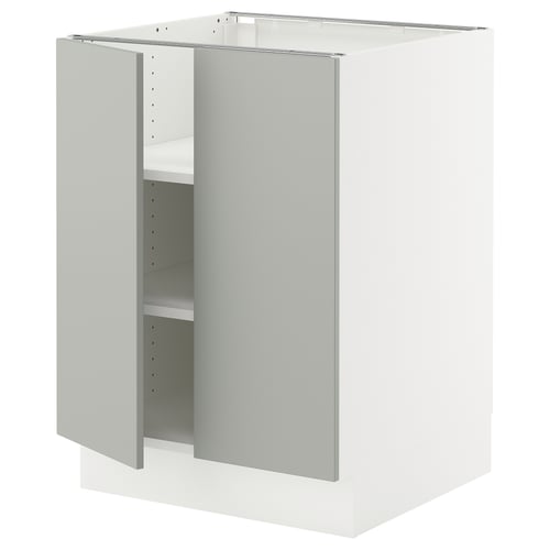 White kitchen cabinet from ikea with light grey door, two shelves, and adjustable hinges.
