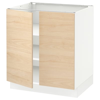 A modern kitchen cabinet from IKEAs SEKTION line in white and light wooden finish with adjustable shelves.