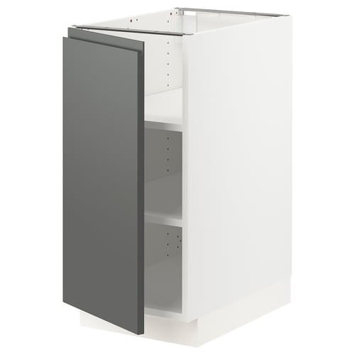 A SEKTION modern kitchen cabinet in white with a grey door, featuring a handle-less design and sturdy construction.