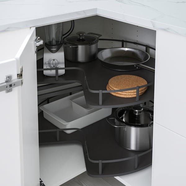 Organised kitchen corner cabinet with pots, pans, and appliances, utilising space efficiently with adjustable shelves and storage solutions.
