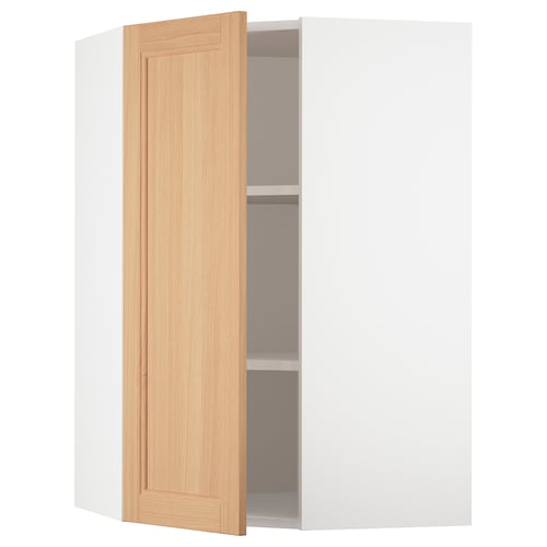 White SEKTION corner kitchen cabinet with oak door open.