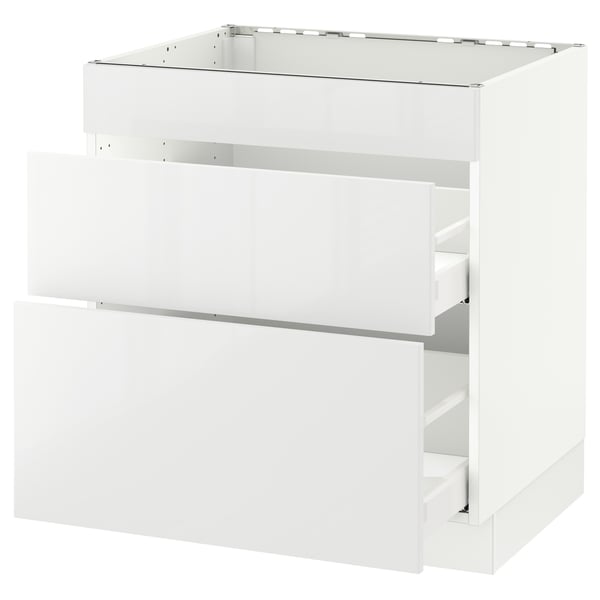 White kitchen cabinet with smooth drawers, modern, glossy finish.