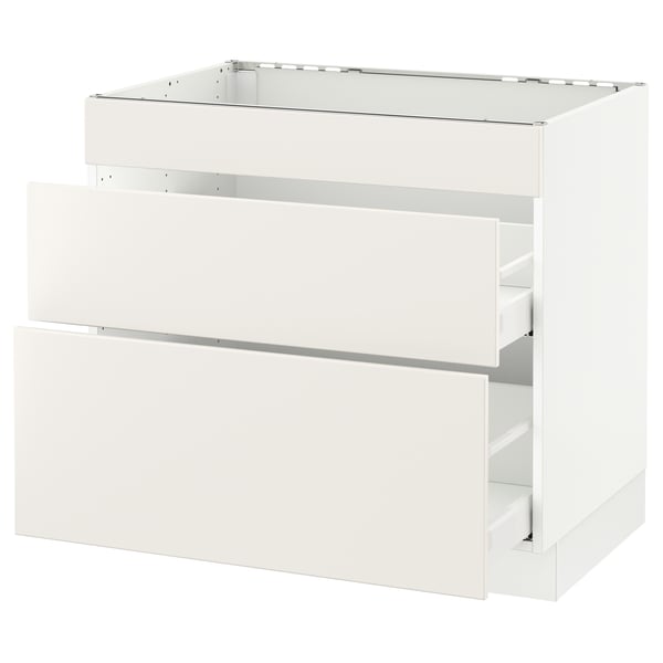 White SEKTION kitchen cabinet with veddinge fronts, sleek design, metal drawer runners.