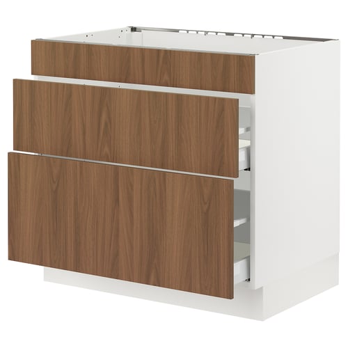 An ikea SEKTION kitchen cabinet with walnut-colored drawers and white sides. It has three drawers and is made of particleboard and foil.