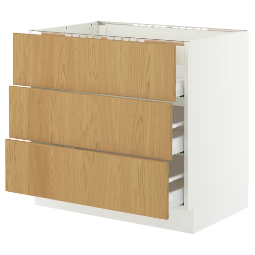 SEKTION oak-veneer kitchen cabinet with white base, three drawers.