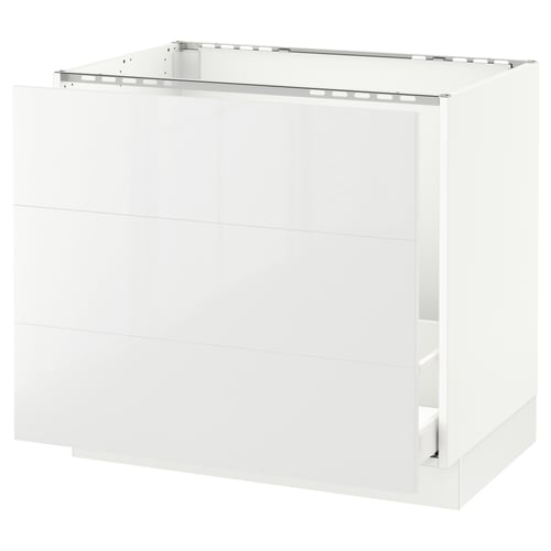 A white SEKTION kitchen cabinet with a glossy finish and a three-drawer design. It has a sleek, modern look.