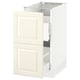 SEKTION kitchen cabinet in off-white with panel design and bevelled edges.