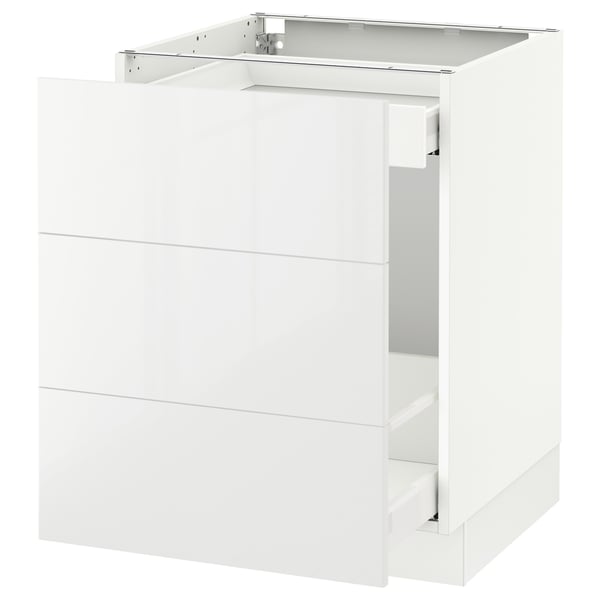 A white SEKTION kitchen cabinet from IKEA, featuring high-gloss, modern design, and full-extension drawers.