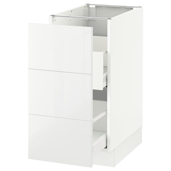 A white SEKTION kitchen cabinet with a glossy finish and one open drawer.
