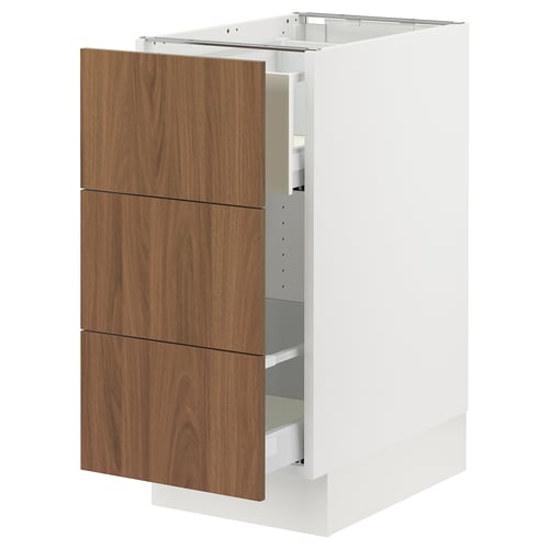 An ikea SEKTION kitchen unit with white cabinet and wood-toned drawers.