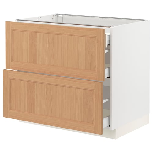 An ikea SEKTION kitchen cabinet in white with natural oak drawers, featuring a modern minimalist design.