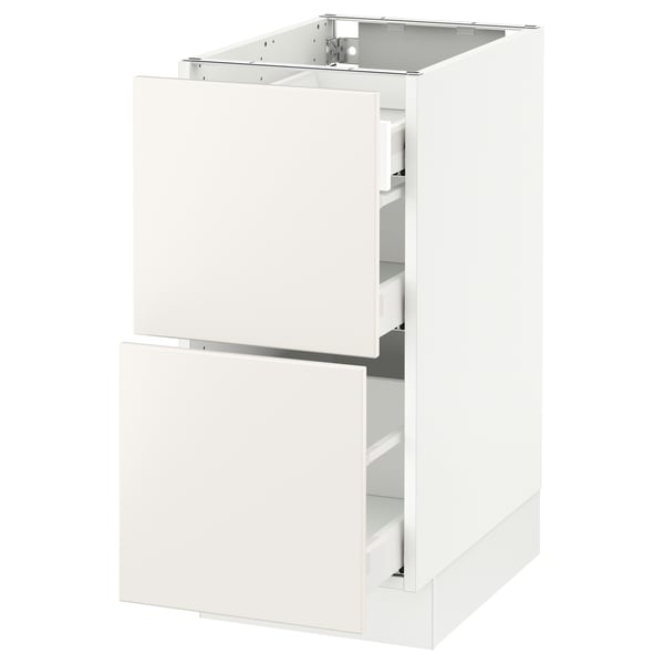 An all-white modern kitchen cabinet from IKEAs SEKTION system, featuring smooth surfaces and integrated drawers.