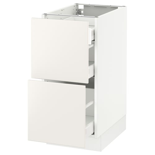 An all-white modern kitchen cabinet from IKEAs SEKTION system, featuring smooth surfaces and integrated drawers.