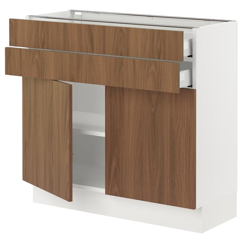 An ikea SEKTION kitchen cabinet with tistorp walnut-colored doors and white frame, featuring drawers and shelves.