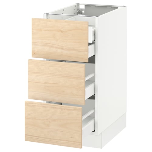 White SEKTION kitchen cabinet with light ash wood drawers.