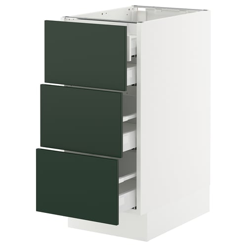 White SEKTION kitchen cabinet with green drawers.