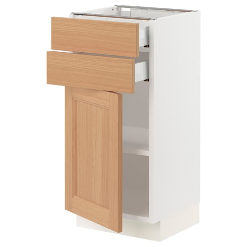 SEKTION kitchen cabinet with oak doors open, showing drawers and shelves.