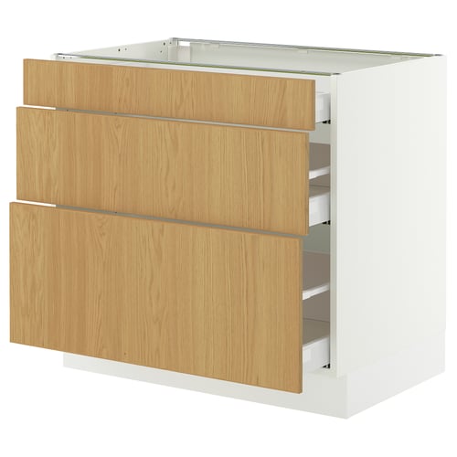 A SEKTION kitchen cabinet in white with three light oak drawers. It a sturdy frame and smooth-running drawers with soft-close mechanisms.