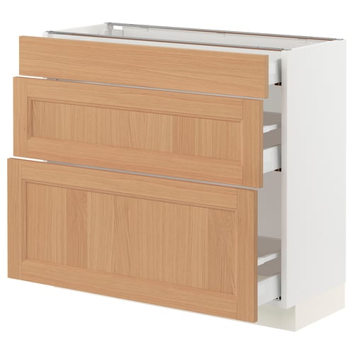 An ikea SEKTION kitchen cabinet with three wooden drawers in a light oak finish.