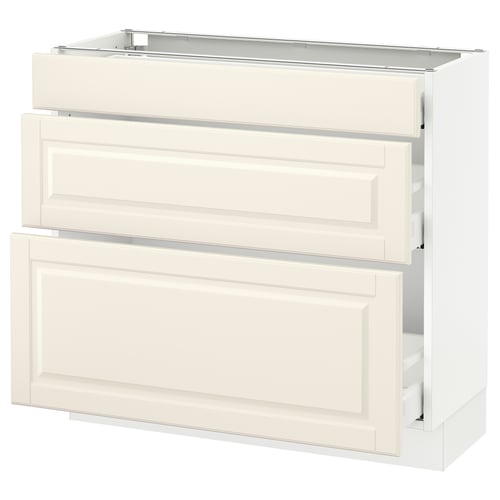 Off-white kitchen cabinet set with bevelled edges and full-extension drawers.