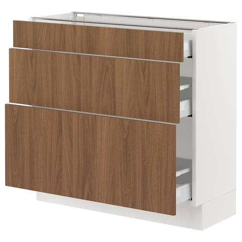 Modern white kitchen cabinet with walnut-brown drawers, smooth surfaces and sleek design.