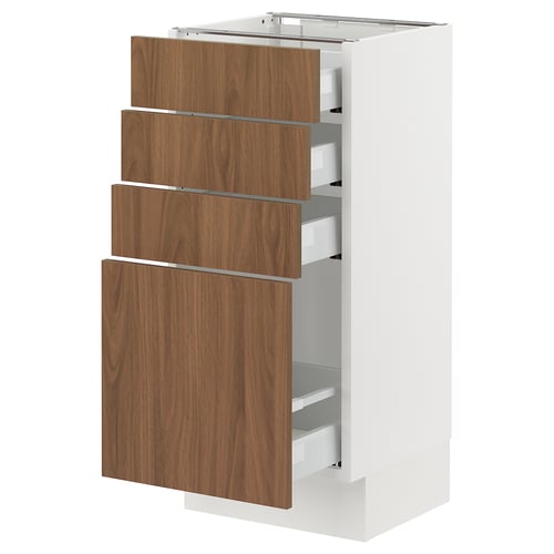 An ikea SEKTION white kitchen cabinet with four walnut-colored drawers.