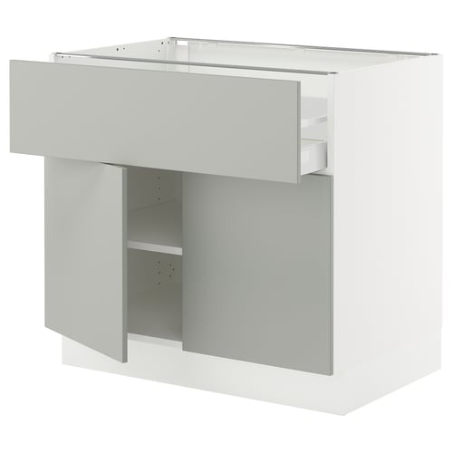 The SEKTION kitchen unit in light grey a drawer and open shelf, combining modern design with functional storage.