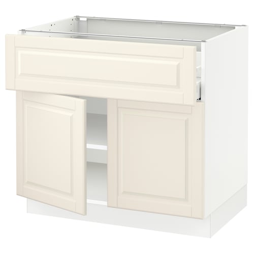 A white SEKTION kitchen cabinet with bevelled off-white doors, featuring adjustable shelves and a traditional design.