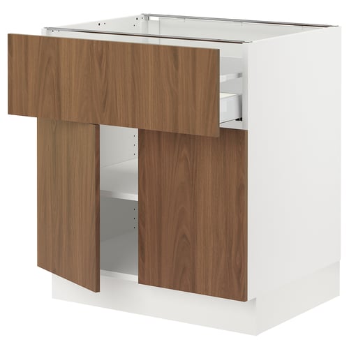 White SEKTION kitchen cabinet with brown tistorp walnut doors, modern streamlined design.