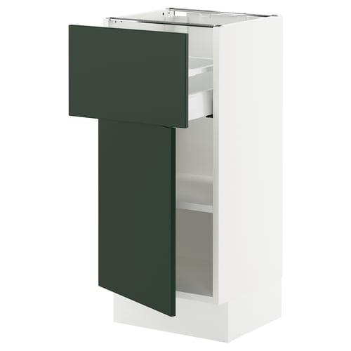 Modern white kitchen unit with dark green drawers, adjustable shelves.