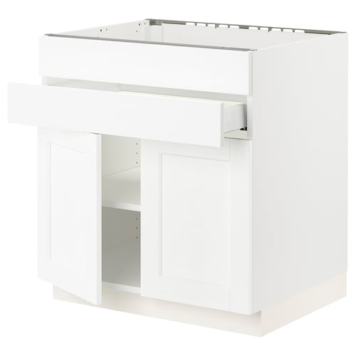 SEKTION kitchen unit in white with adjustable shelves, solid frame, and wood grain texture.