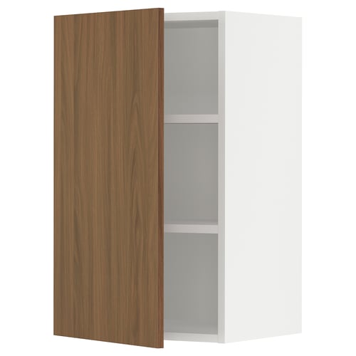 Open white SEKTION cabinet with wooden door, two shelves, slightly ajar.
