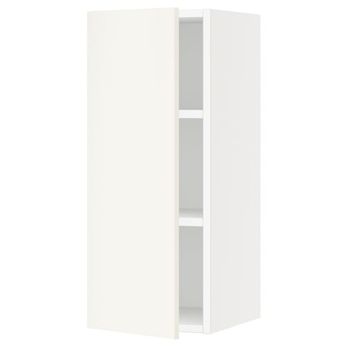 A sleek, white SEKTION wall cabinet with a modern design, featuring two adjustable shelves and smooth, closed doors.