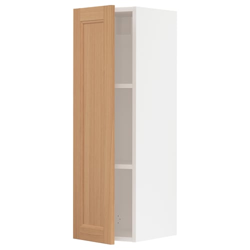 White kitchen cabinet with oak door opened.