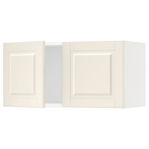 Displays white SEKTION kitchen wall cabinets with a classic design and bevelled edges.