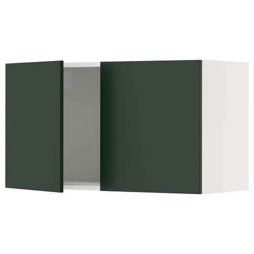 Green ikea SEKTION kitchen cabinet with one open door, white interior.